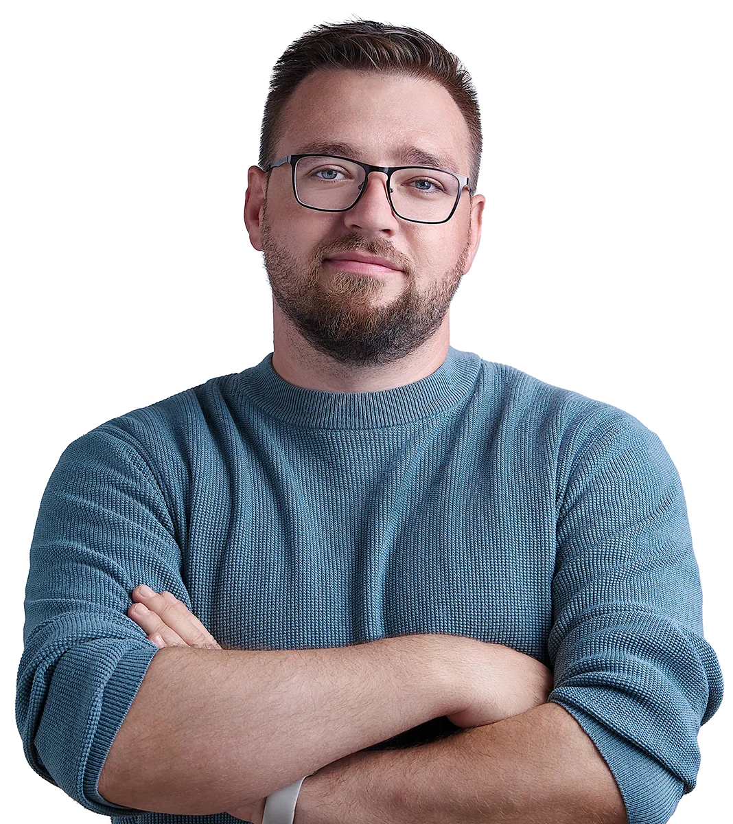 Paul Böstro mit Brille und blauem Pullover, die Arme verschränkt